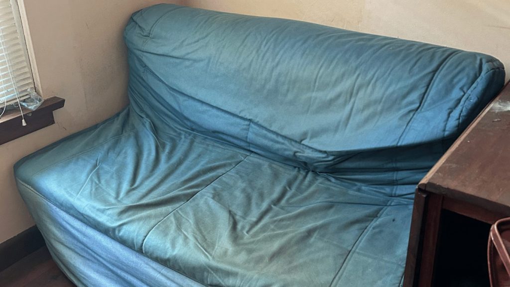 image-of-tired-stained-sofa-bed