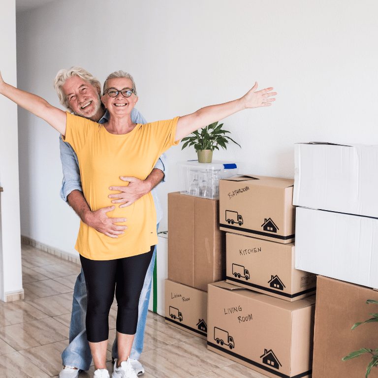 image-of-2-people-in-new-house-hugging-in-front-of-packed-belongings